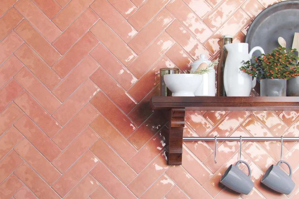 salmon colored glazed porcelain backsplash in modern kitchen